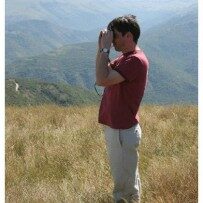 Man using a pair of binoculars