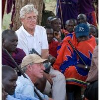 Tom Hill with people from a village